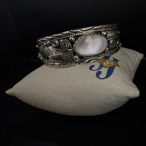 Sterling Silver Cuff Bracelet With Intricate Leaf And Scroll Details.